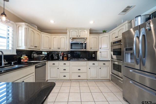 kitchen with stainless steel appliances, decorative light fixtures, crown molding, and tasteful backsplash