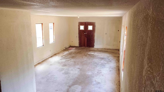 entrance foyer with a textured ceiling