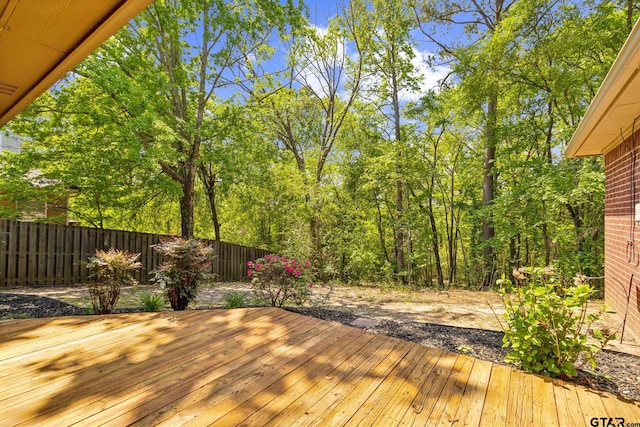 wooden deck featuring fence