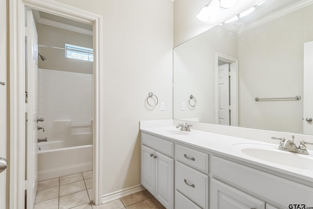 bathroom with crown molding, double vanity, a sink, and tile patterned floors