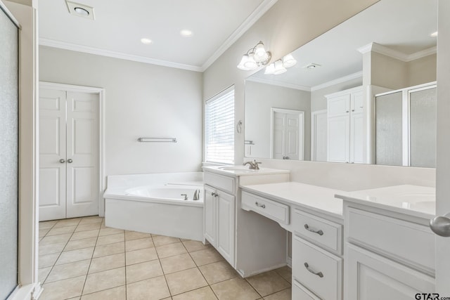bathroom featuring a sink, double vanity, tile patterned flooring, a shower stall, and a garden tub