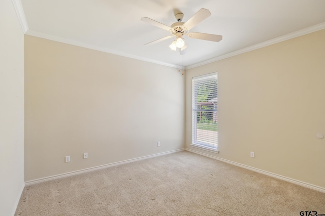 unfurnished room featuring carpet flooring, baseboards, ornamental molding, and ceiling fan