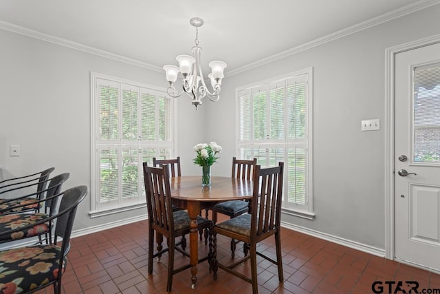 5807 Stoneleigh Dr, Tyler, TX 75703 - dining area with a chandelier, brick floors, crown molding, plenty of natural light, and baseboards