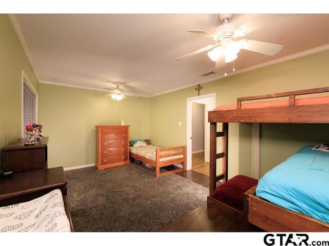 bedroom featuring ceiling fan and ornamental molding