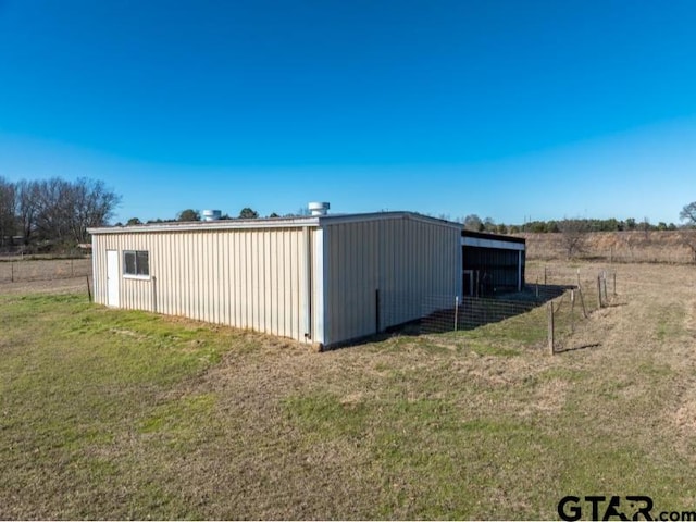 view of outdoor structure with a yard