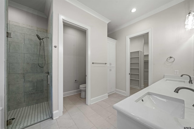 bathroom with tile patterned floors, walk in shower, ornamental molding, vanity, and toilet