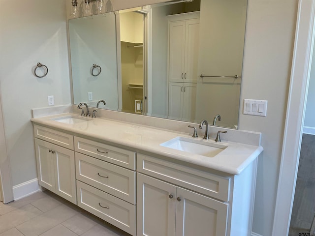 bathroom with vanity and tile patterned floors