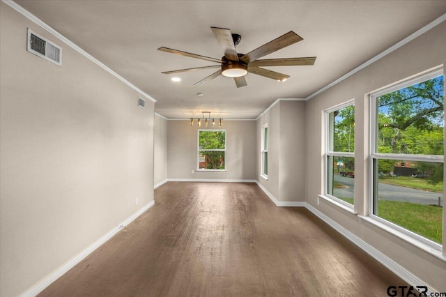 1330 Graham Dr, Tyler, TX 75701 - spare room featuring ornamental molding, baseboards, visible vents, and dark wood finished floors