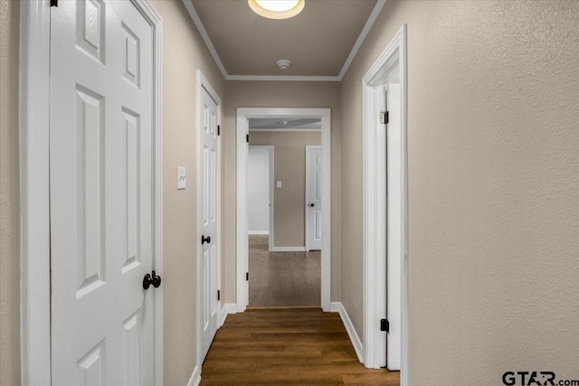 1330 Graham Dr, Tyler, TX 75701 - corridor featuring dark wood-style flooring, crown molding, and baseboards