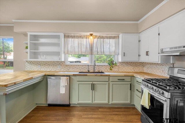 1330 Graham Dr, Tyler, TX 75701 - kitchen featuring under cabinet range hood, ornamental molding, a sink, wood counters, and stainless steel appliances