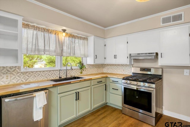 1330 Graham Dr, Tyler, TX 75701 - kitchen with wood counters, stainless steel appliances, a sink, and visible vents