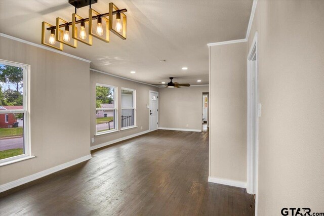 1330 Graham Dr, Tyler, TX 75701 - spare room featuring ornamental molding, baseboards, and dark wood-style floors