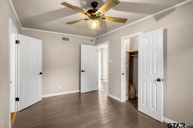 1330 Graham Dr, Tyler, TX 75701 - unfurnished bedroom featuring baseboards, dark wood-style flooring, crown molding, and visible vents