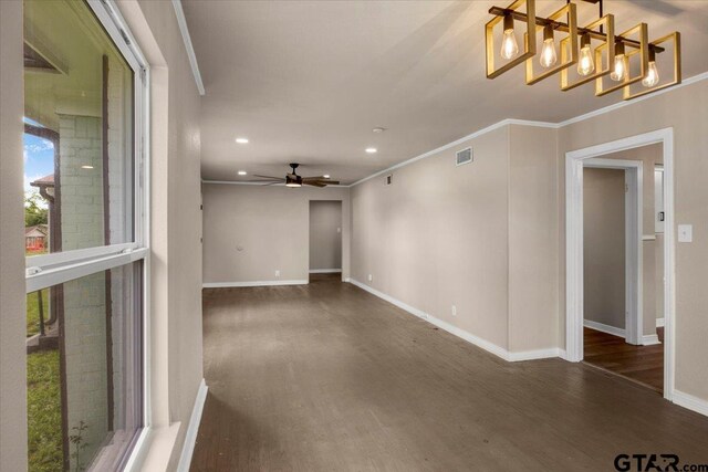 1330 Graham Dr, Tyler, TX 75701 - spare room with ceiling fan with notable chandelier, wood finished floors, visible vents, recessed lighting, and baseboards