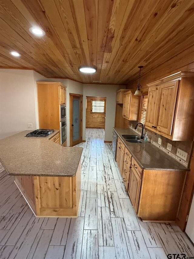 1801 Robbins Rd, Athens, TX 75751 - kitchen featuring a sink, wood ceiling, light wood-style flooring, a peninsula, and appliances with stainless steel finishes