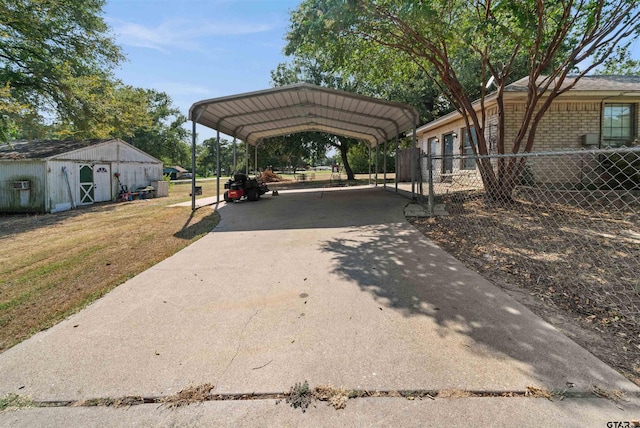 view of parking / parking lot featuring a lawn and a carport