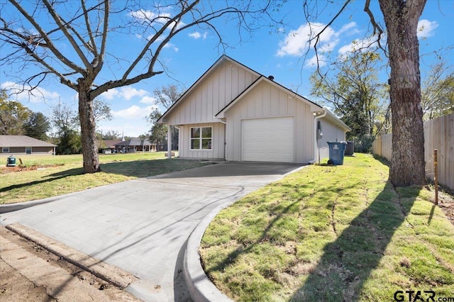 view of front of house featuring a garage and a front lawn