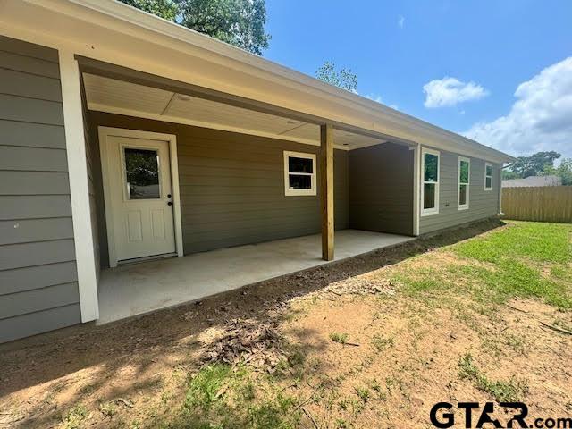 641 N Weldon St, Frankston, TX 75763 - rear view of property with a patio area and fence