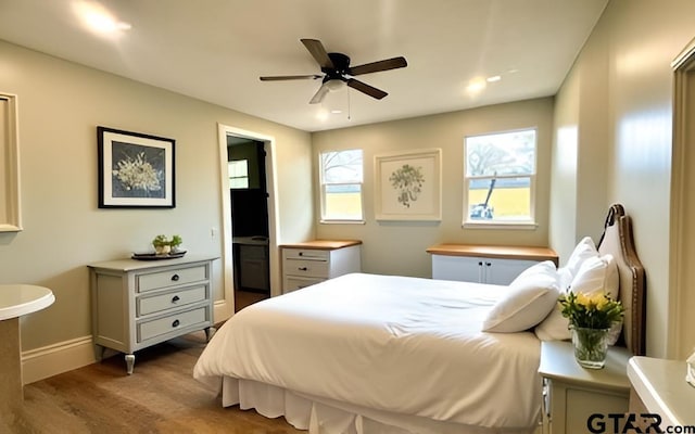 641 N Weldon St, Frankston, TX 75763 - bedroom with wood finished floors, baseboards, and a ceiling fan
