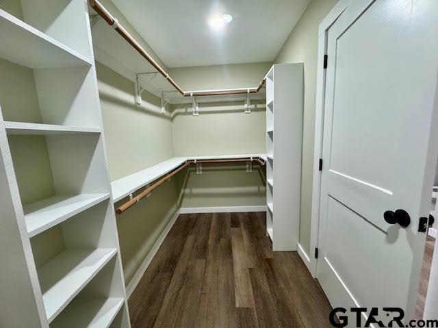 641 N Weldon St, Frankston, TX 75763 - walk in closet featuring dark wood finished floors