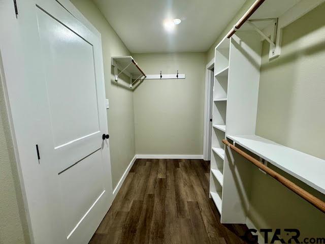 641 N Weldon St, Frankston, TX 75763 - spacious closet featuring dark wood-style floors