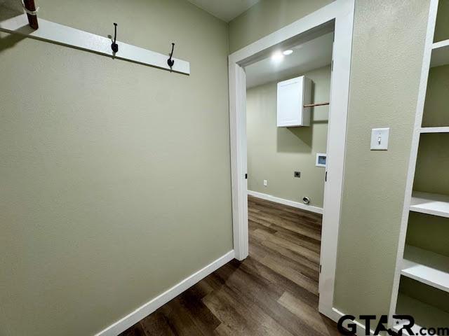 641 N Weldon St, Frankston, TX 75763 - hallway with dark wood-style flooring and baseboards