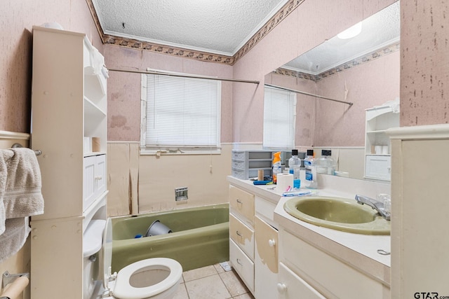 full bath featuring bathing tub / shower combination, ornamental molding, a textured ceiling, vanity, and tile patterned flooring