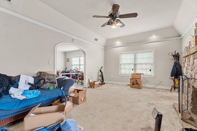 interior space with arched walkways, light carpet, vaulted ceiling, and visible vents