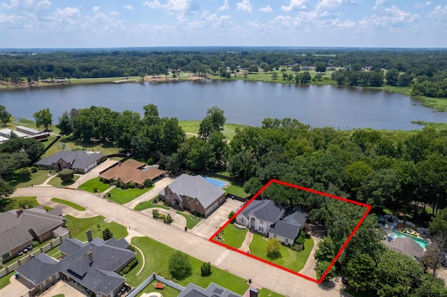 birds eye view of property with a water view