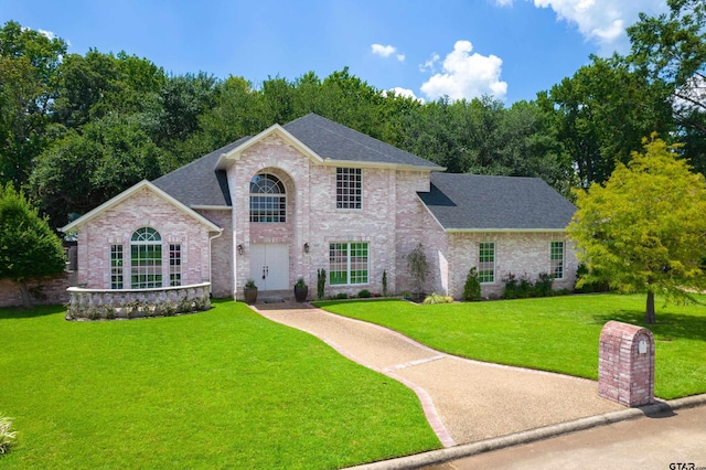 view of front of home with a front lawn