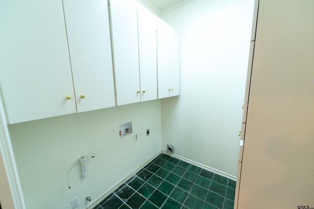 washroom featuring electric dryer hookup, hookup for a washing machine, and cabinets