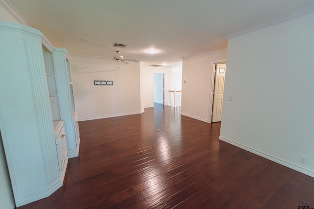 empty room with dark wood-type flooring, ceiling fan, and ornamental molding