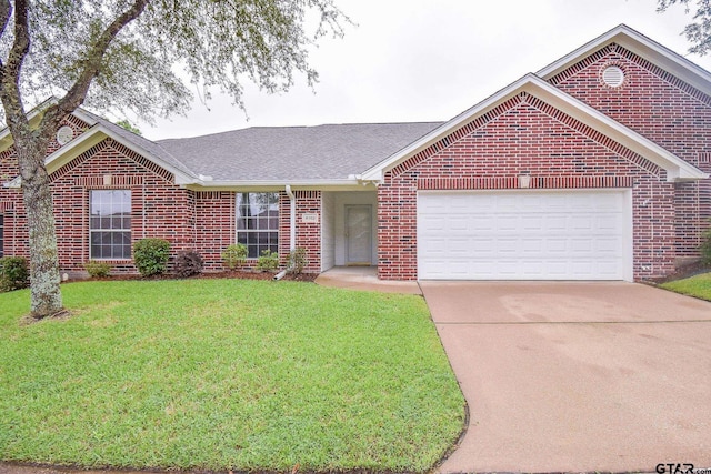 ranch-style home featuring a garage and a front lawn