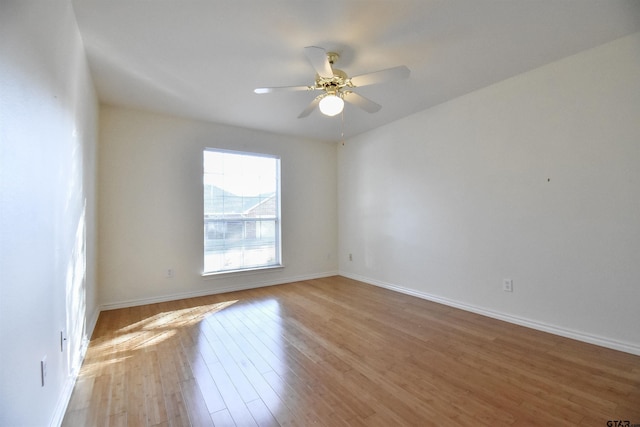 unfurnished room with ceiling fan and light hardwood / wood-style flooring