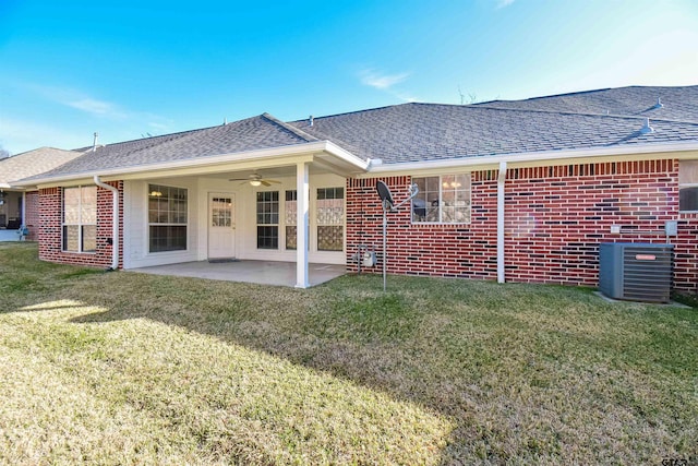 rear view of property with a yard, central AC unit, a patio area, and ceiling fan