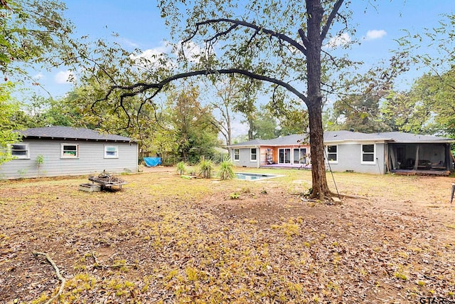 view of yard featuring a sunroom