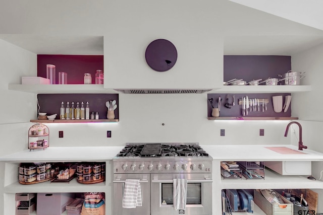 kitchen featuring double oven range and sink