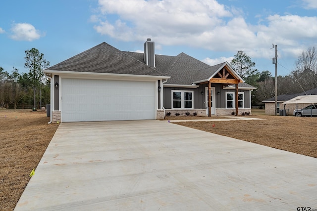 view of front of home featuring a garage and a front yard