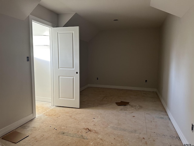 additional living space with vaulted ceiling