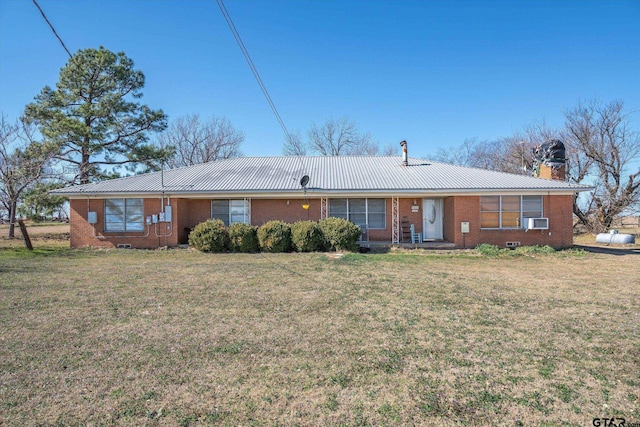 ranch-style home featuring cooling unit and a front lawn