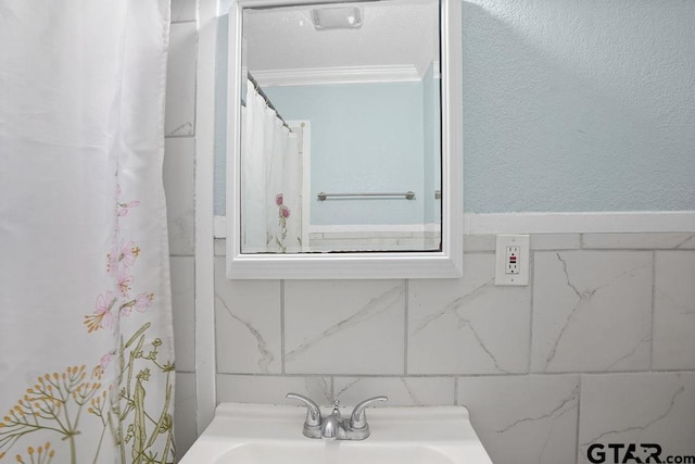 818 Rusk St, Tyler, TX 75701 - bathroom with crown molding and a sink