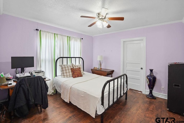 818 Rusk St, Tyler, TX 75701 - bedroom with crown molding, hardwood / wood-style floors, ceiling fan, and a textured ceiling