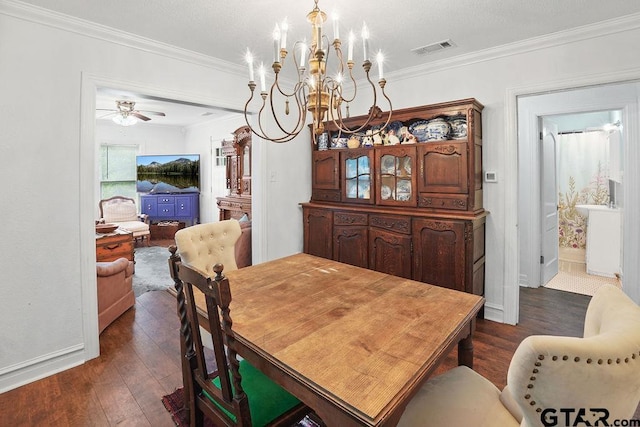 818 Rusk St, Tyler, TX 75701 - dining area featuring dark wood-style floors, a chandelier, crown molding, and a ceiling fan