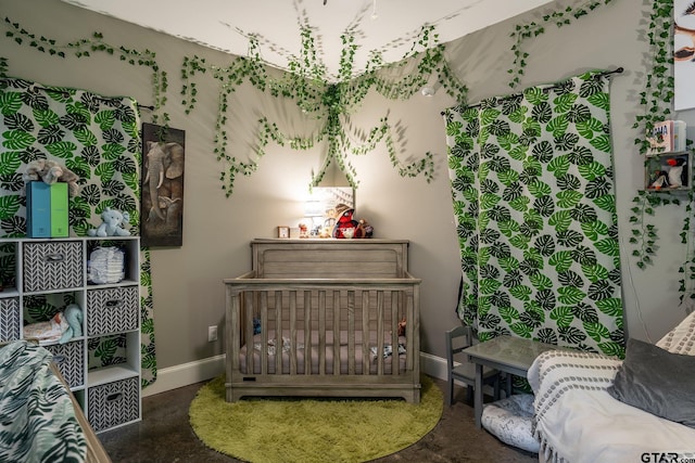 bedroom featuring baseboards