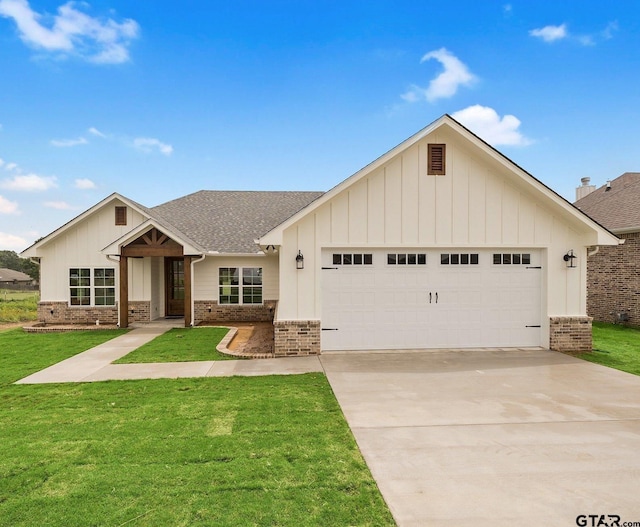 single story home with concrete driveway, roof with shingles, an attached garage, a front lawn, and brick siding