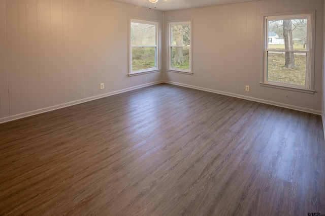 spare room with dark hardwood / wood-style flooring