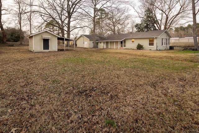 view of yard with a shed and central AC