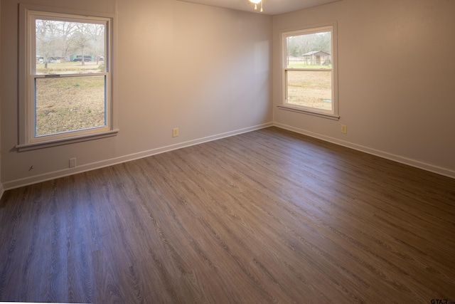 empty room featuring dark hardwood / wood-style floors