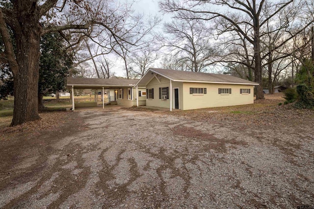 view of front of home with a carport