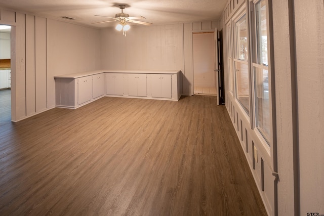 empty room featuring hardwood / wood-style flooring and ceiling fan